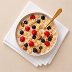 Gluten free quinoa cereal with milk and berries